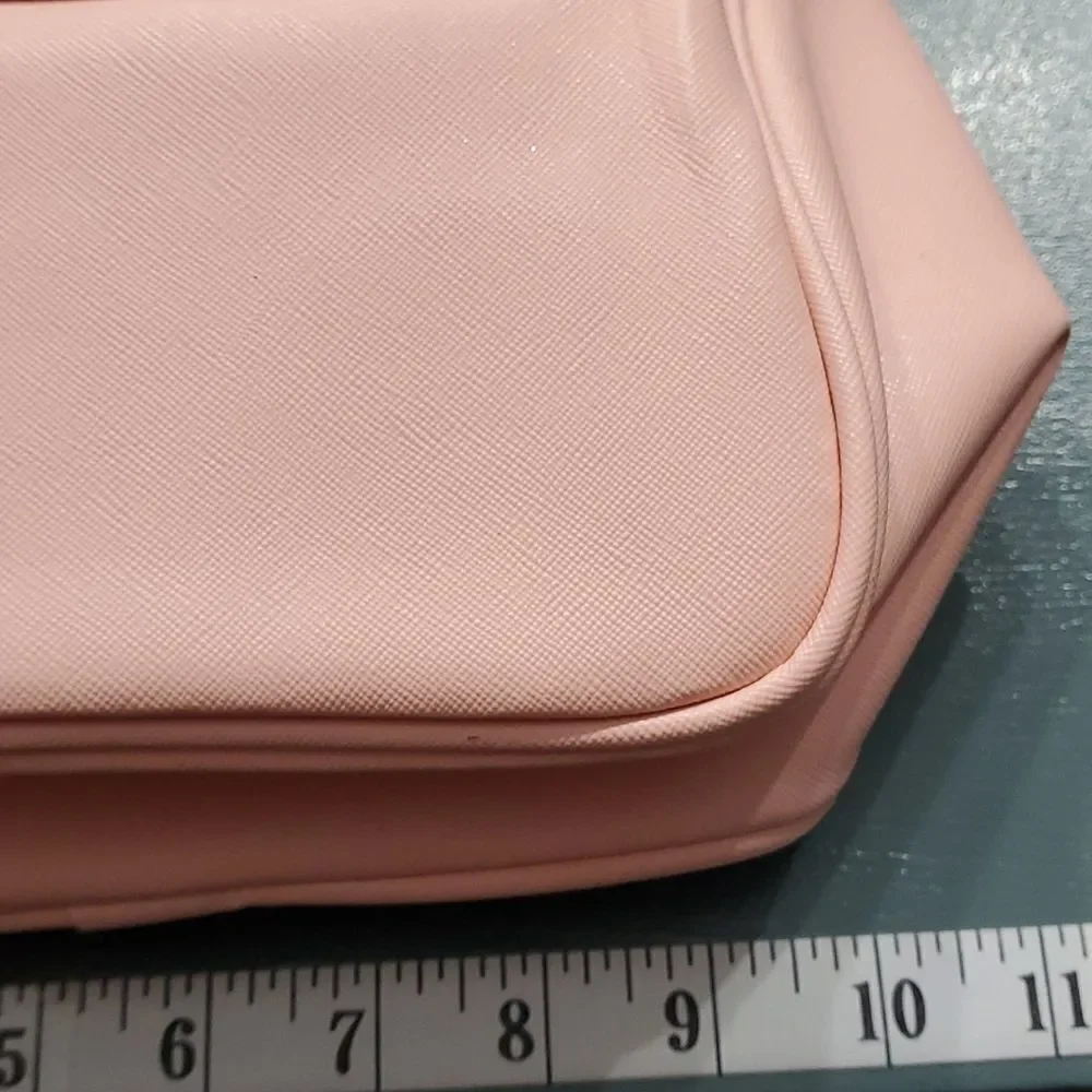Two cosmetic bags.‎ One in vintage and homemade. The other is pink and la…